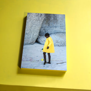 SOUTH AFRICA - cape town - girl with yellow coat on the beach